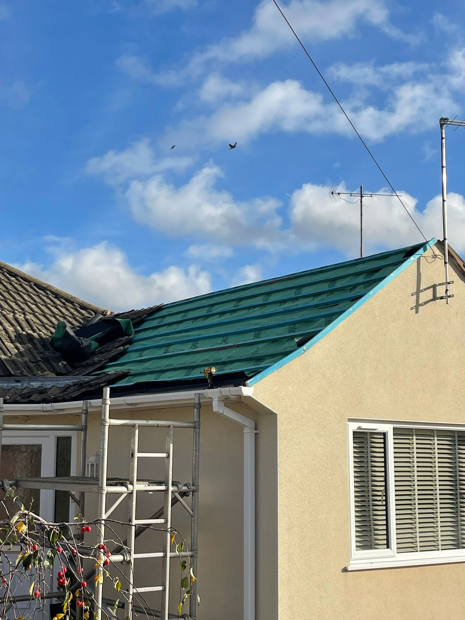 Professional roofing work in progress